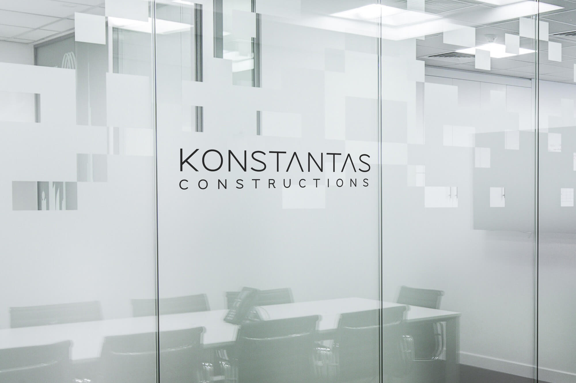 Konstantas Renovation logo in a meeting room
